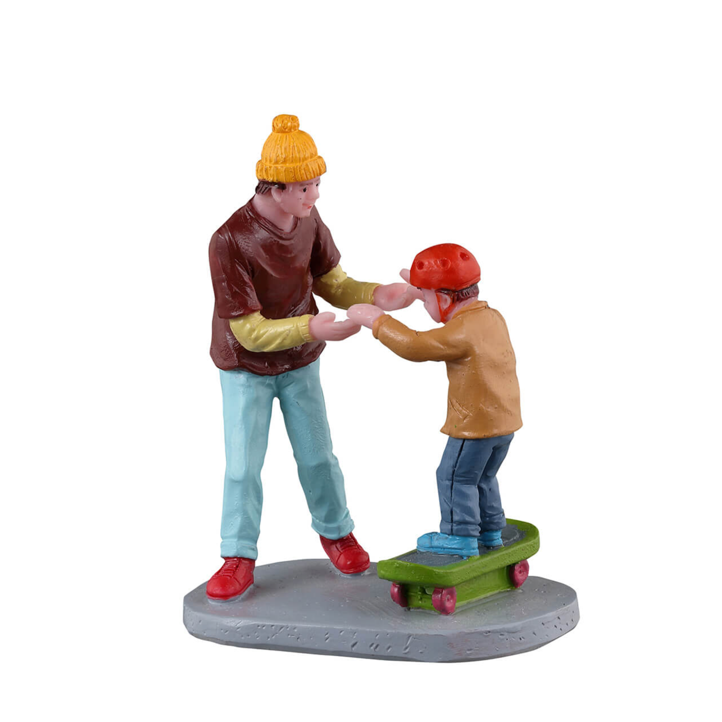 Figurine of two people holding hands with one on a skateboard on a white background