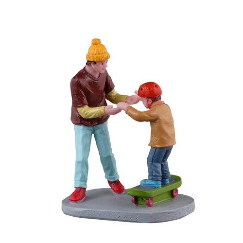 Figurine of two people holding hands with one on a skateboard on a white background