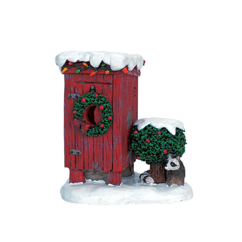 Decorative red outhouse with a wreath, snow, and small figures on a white background