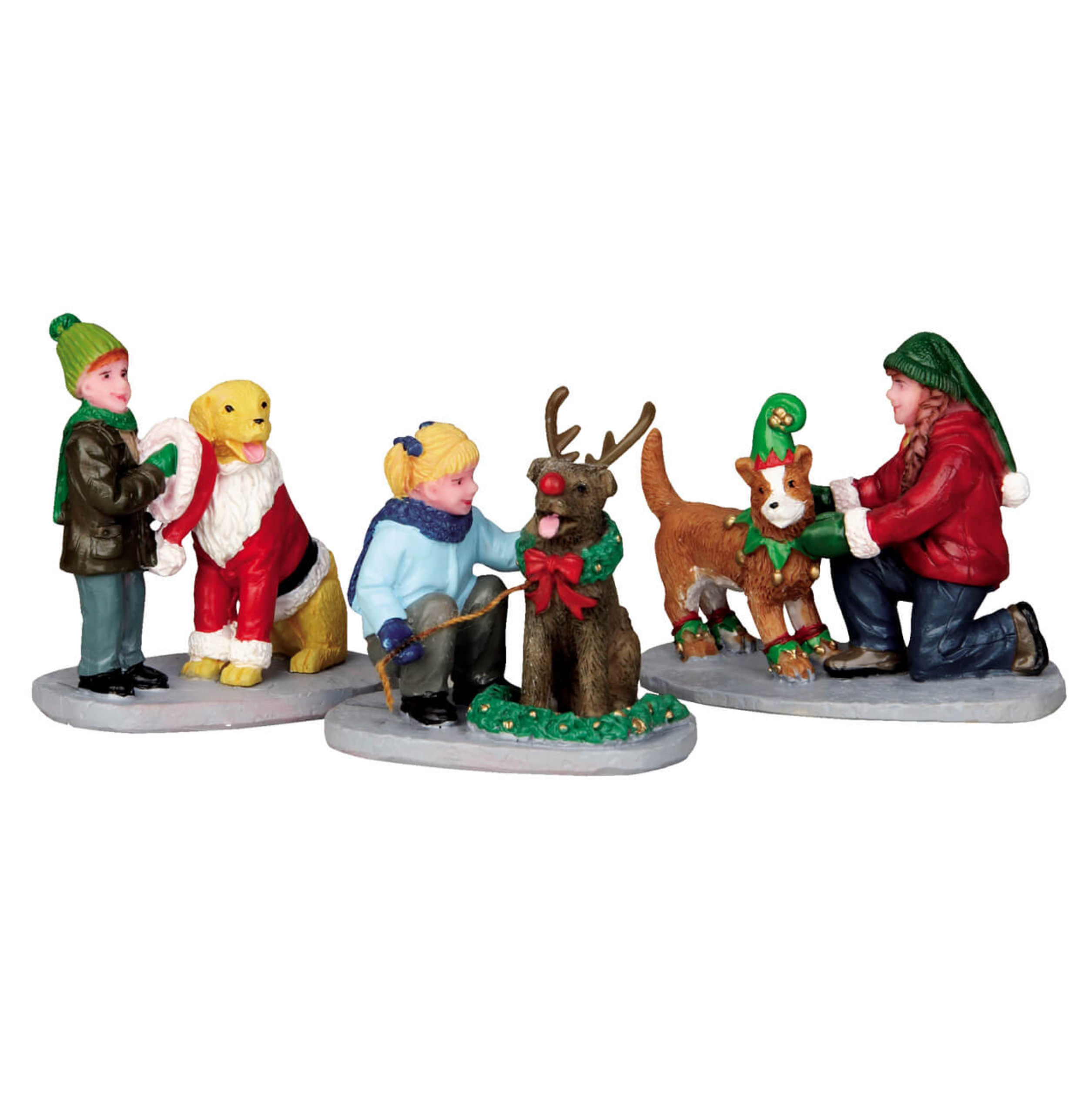 Set of Christmas-themed figurines with children and dressed up dogs on a white background