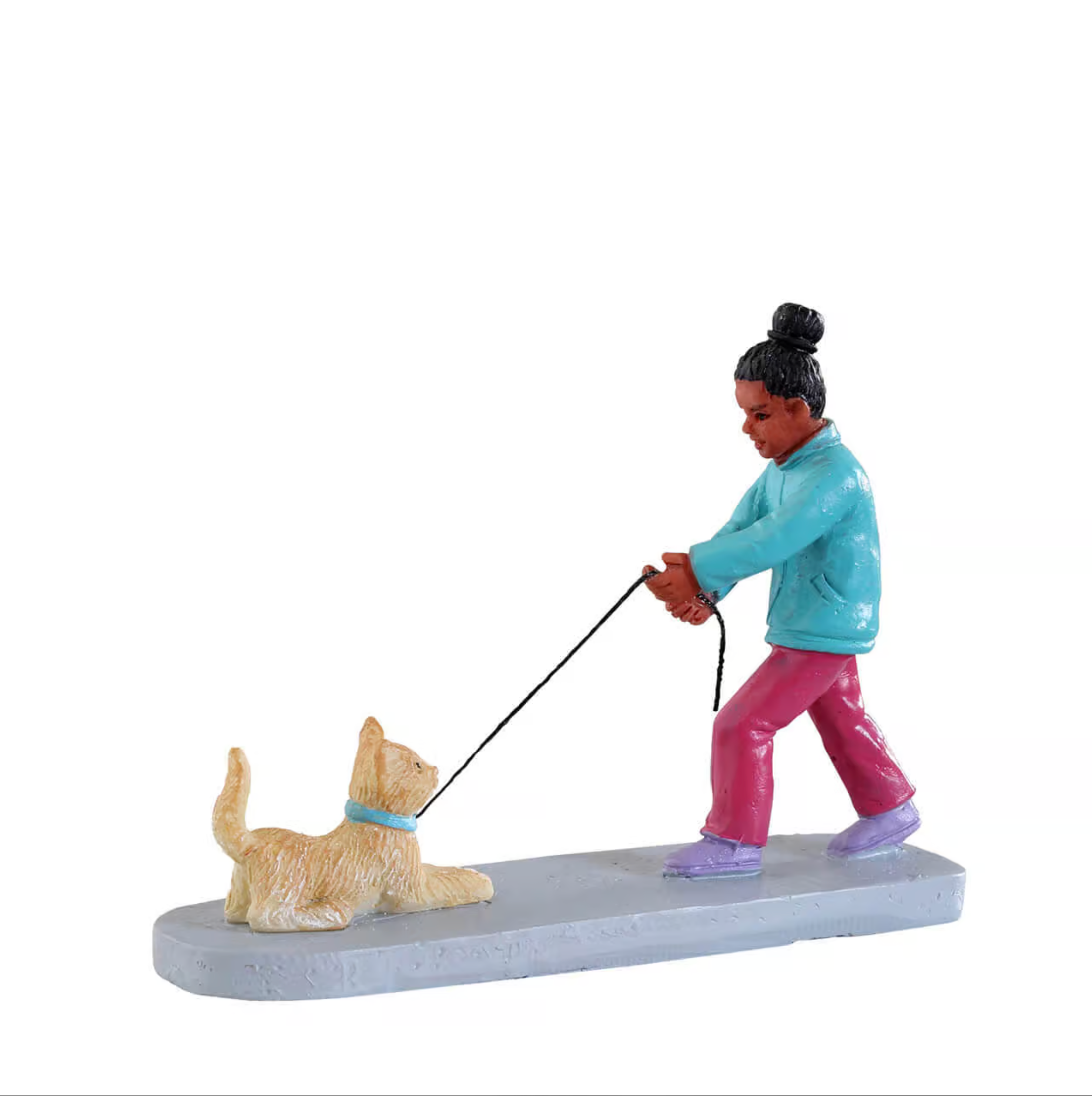 Figurine of a person walking a dog on a white background