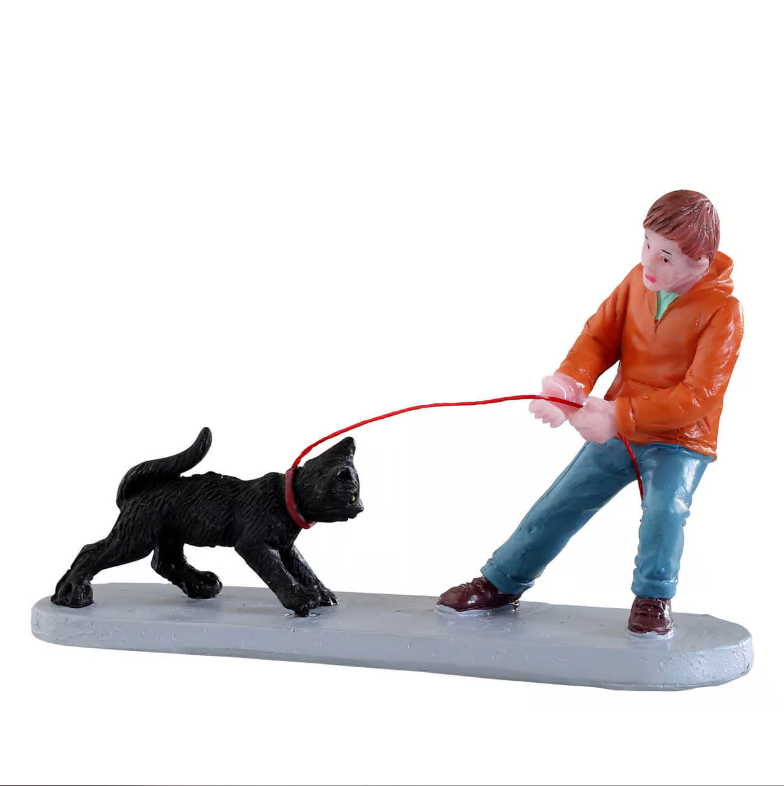 Figurine of a boy walking a cat on a white background