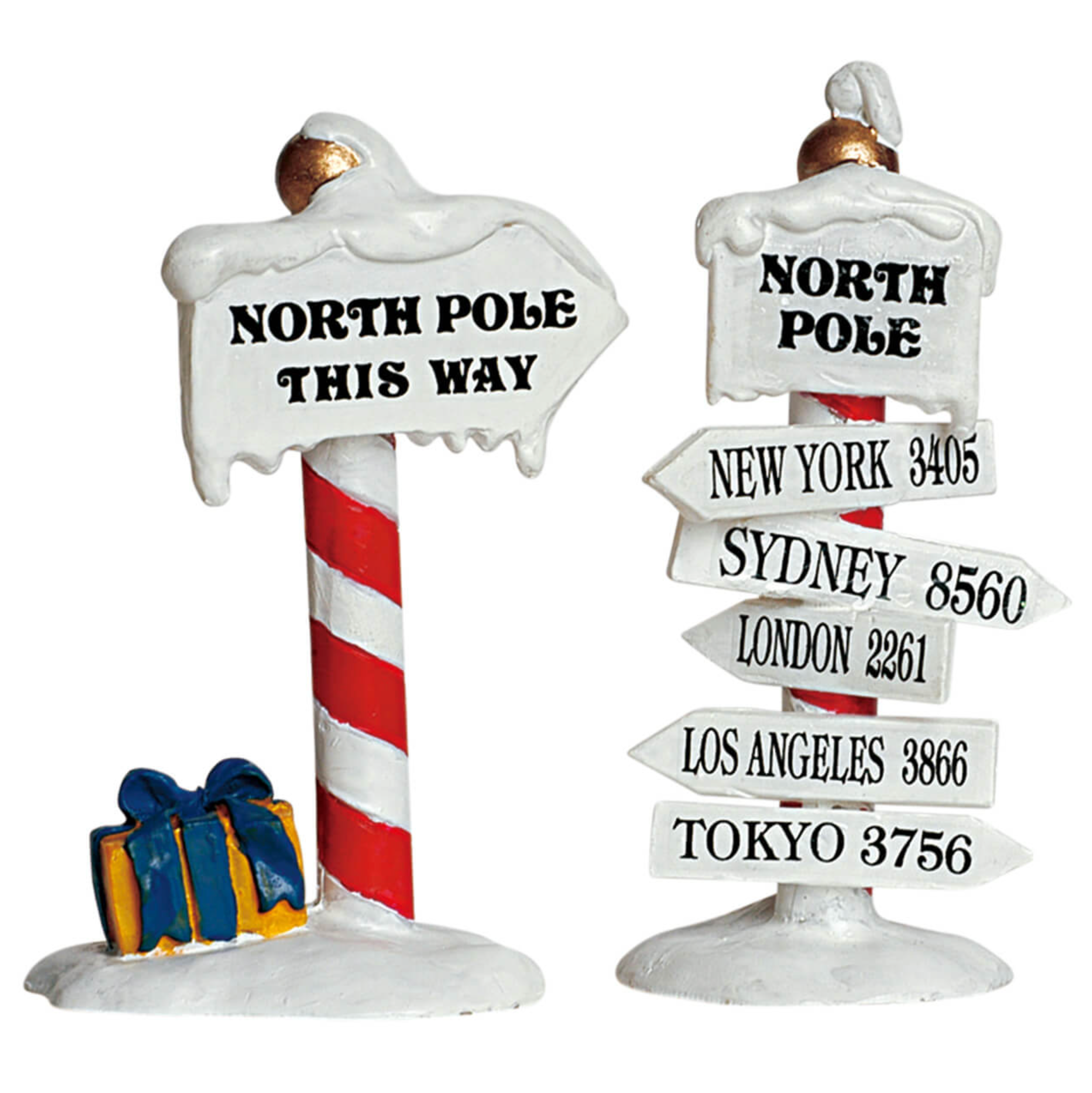 Decorative minature Christmas sign with 'North Pole This Way' and city names on a white background