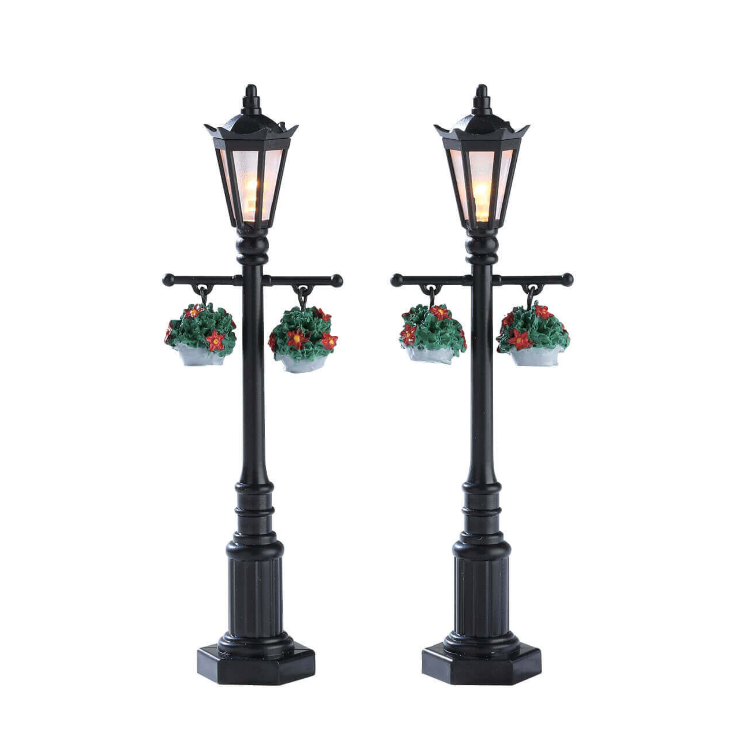 Two decorative street lamps with wreaths on a white background
