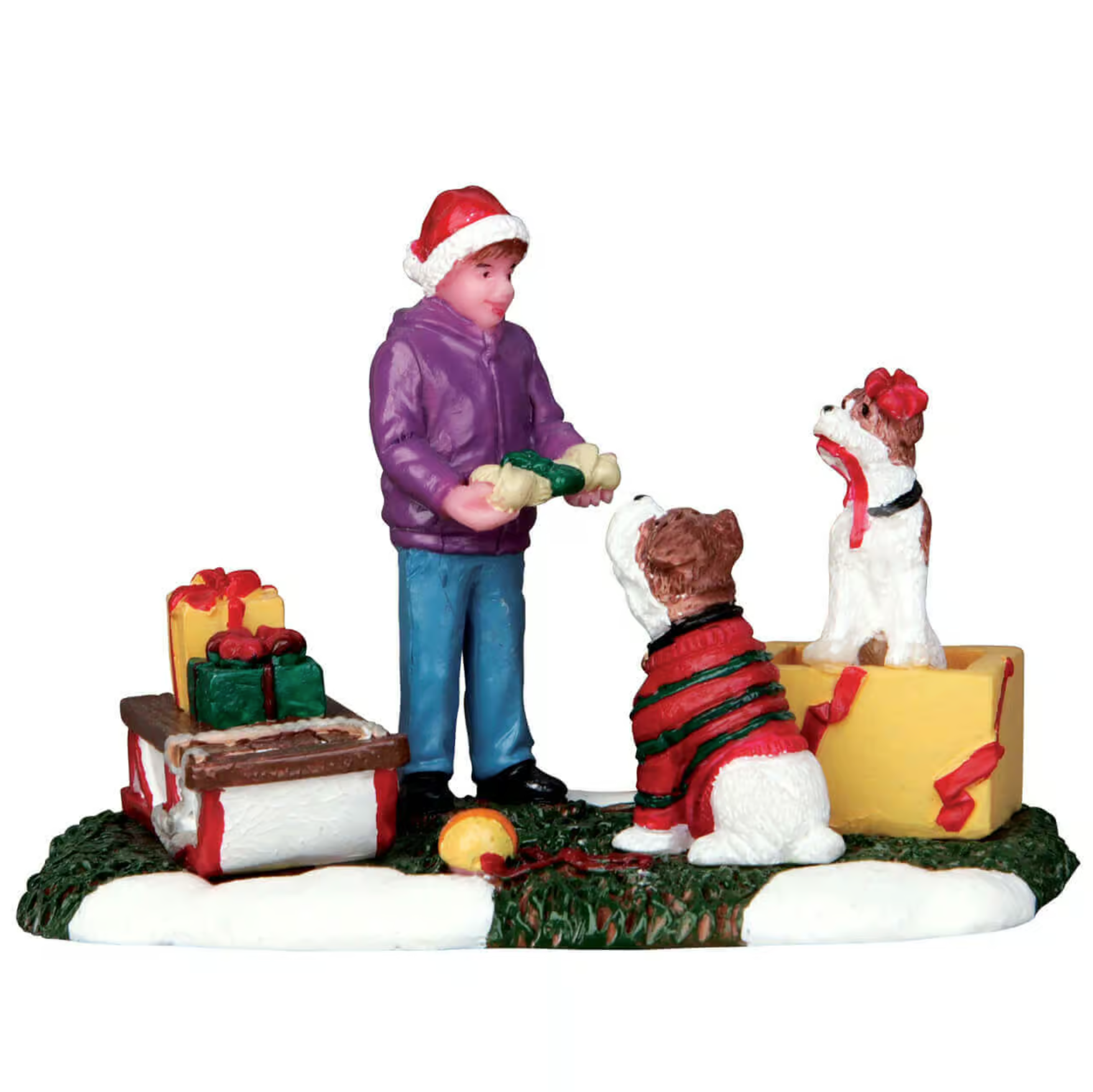 Christmas-themed figurine of a person and two dogs with presents on a white background