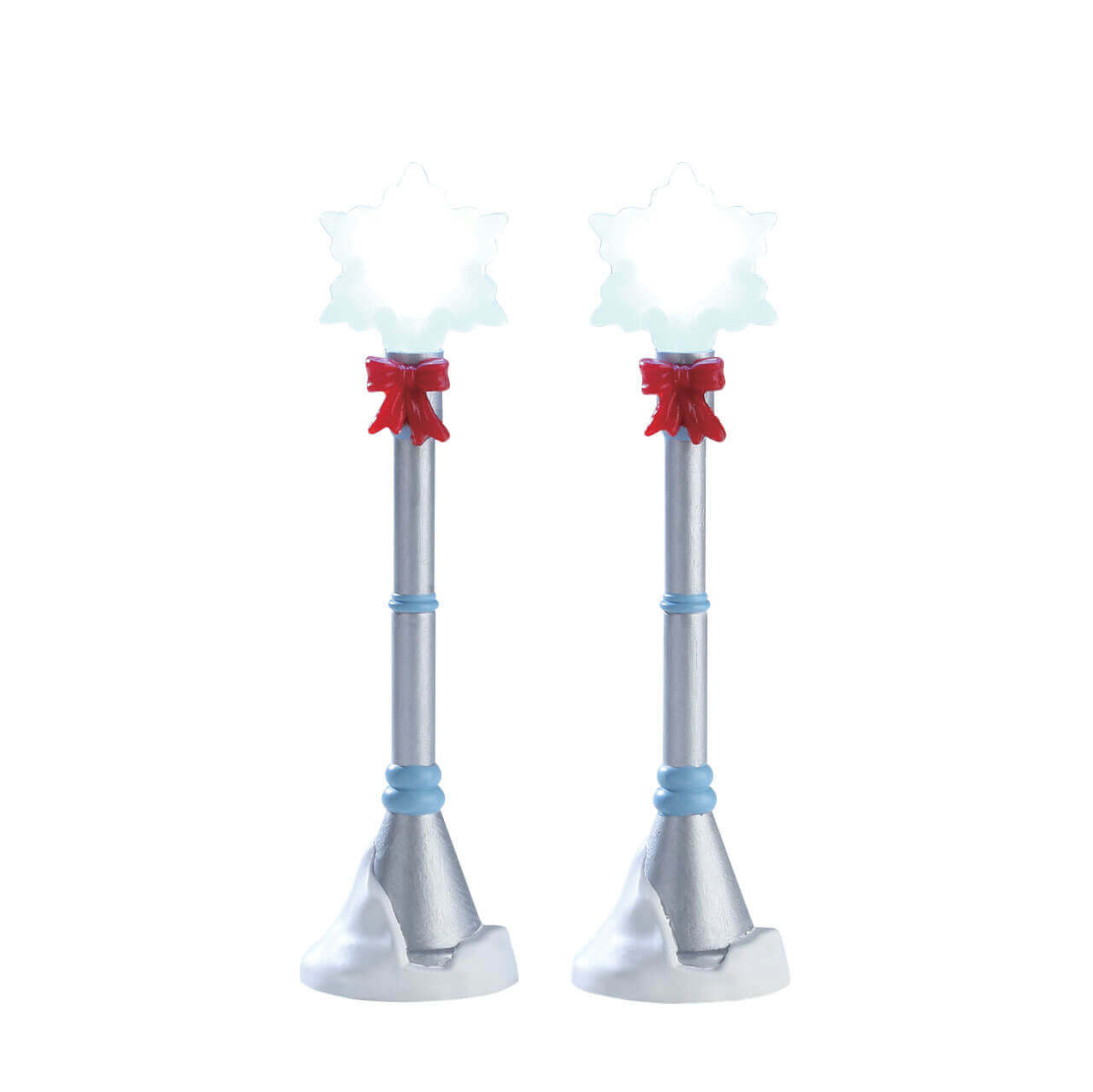 Two silver Lemax lighted light posts with red bows on a white background