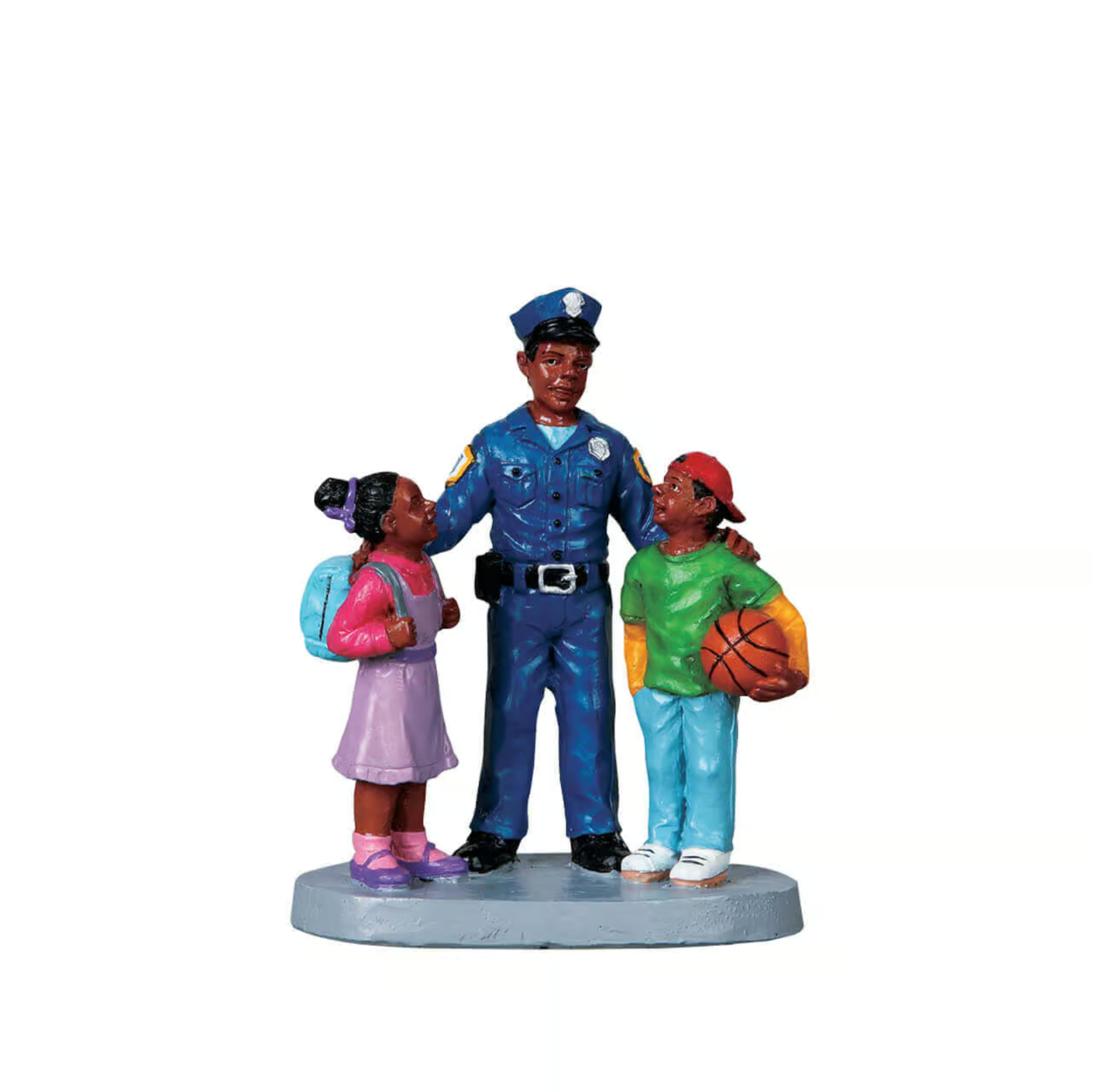 Figurine of a police officer with two children on a white background
